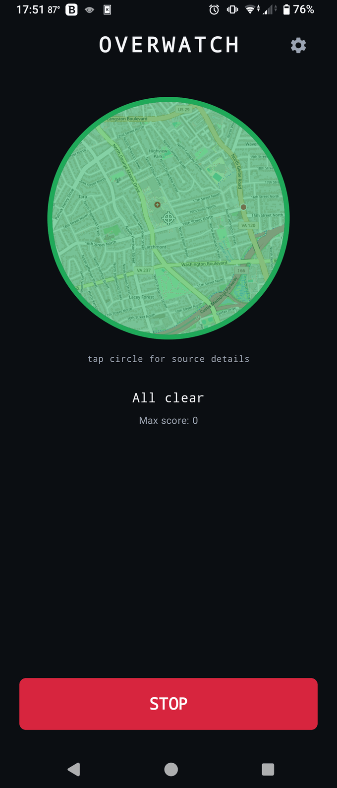 OVERWATCH main screen: a live map inside a green "all clear" threat ring, centered on the user with a crosshair, and a STOP button.